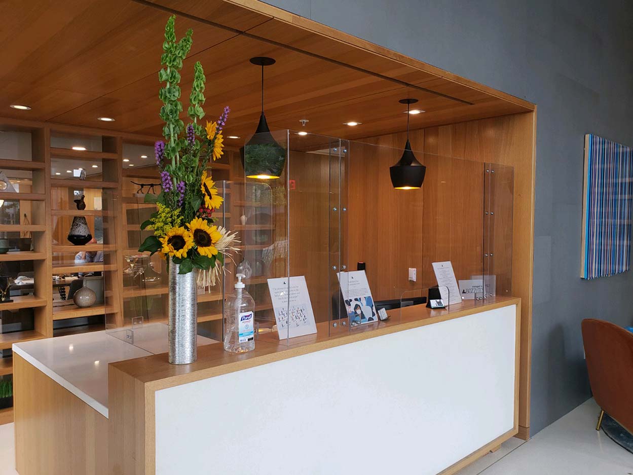 office-reception-front-desk-clear-barrier-installation-3-image-works-glass Clear custom protective barrier for business office front desk reception